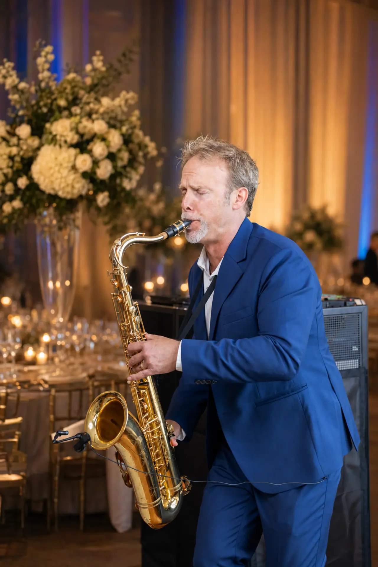 Live saxophone performance in an elegant wedding reception room